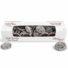 Dark chocolate nonpareils in a window box on a white background